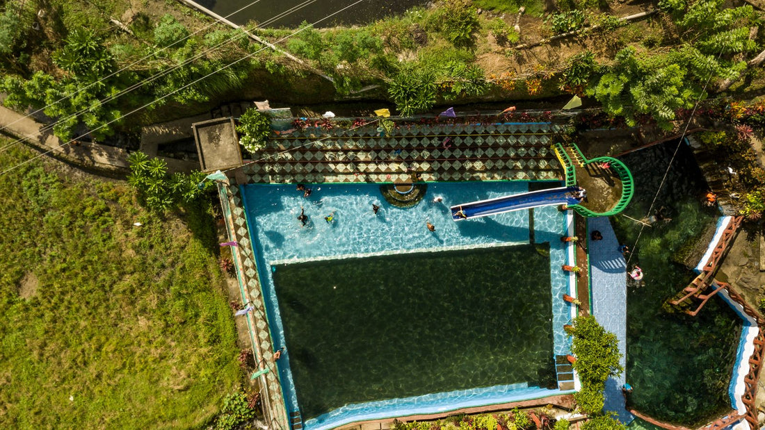 People enjoying a sunny day in a residential-style outdoor pool